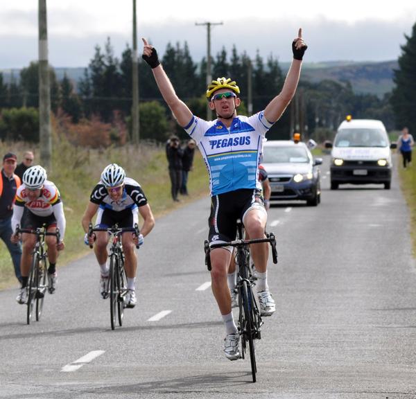 Sam Horgan celebrates victory in RaboDirect New Zealand Club Championships senior road race in Hawkes Bay